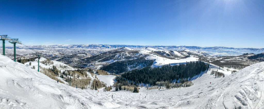 Panoramic view of Wasatch mountains at Deer Valley ski resort from near the top of Empire lift